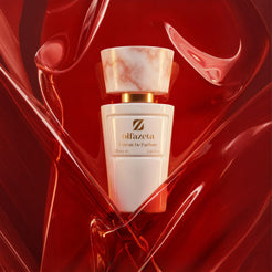 White Olfazeta by Chogan Millésime N°23 bottle with a marbled cap, embraced by waves of translucent red glass