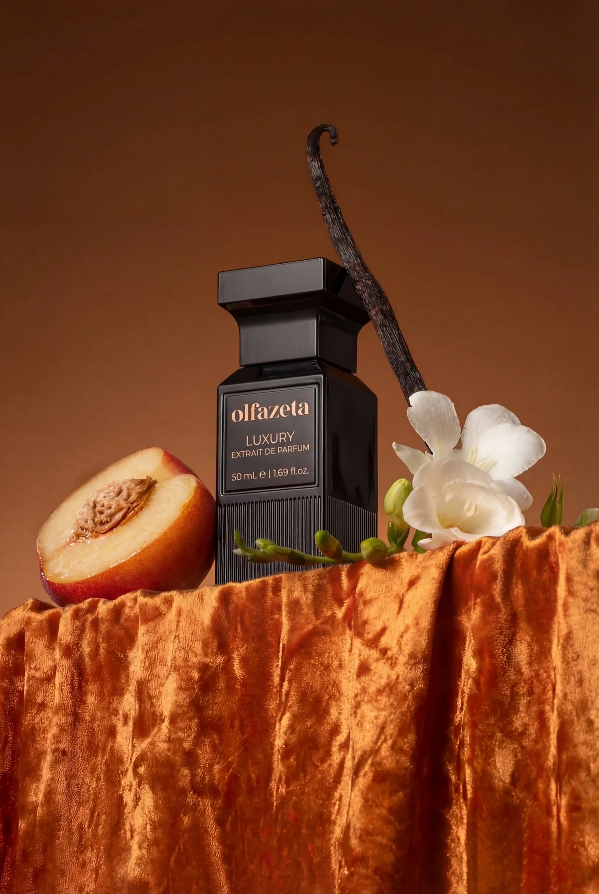 Black Olfazeta by Chogan Luxury N°134 bottle on coppery velvet, half a peach, white freesias and vanilla