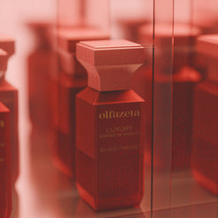 Red bottle Olfazeta by Chogan Luxury N°146, Extrait de Parfum 50 ml in close-up in a muted red setting